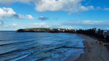 A beautiful view of foamy waves hitting the seashore