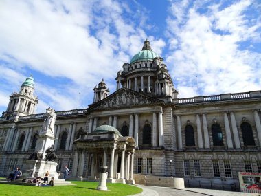A beautiful view of Belfast City Hall under the cloudy sky in Donegall Square, Northern Ireland