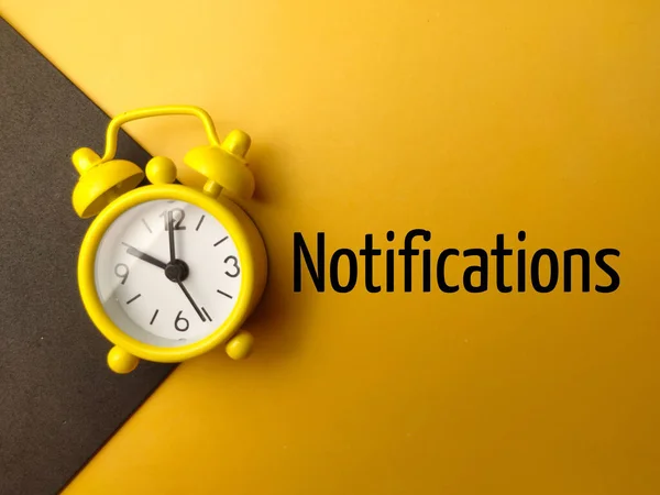 Top View Alarm Clock Word Notifications Yellow Background — Stock Photo, Image