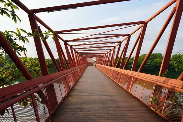 slanted orange red colored bridge