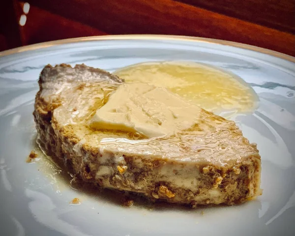A closeup shot of curry butter melting on a slice of turkey