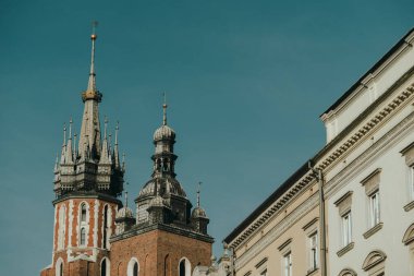 The top of the Bugle Tower against blue sky background in Krakow, Poland