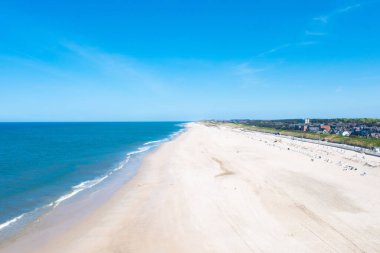 A scenic view of a sand beach and the blue sea of the Island Sylt in Germany