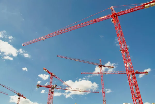 Low Angle Shot Red Cranes Construction Sites Cloudy Sky — Stock fotografie