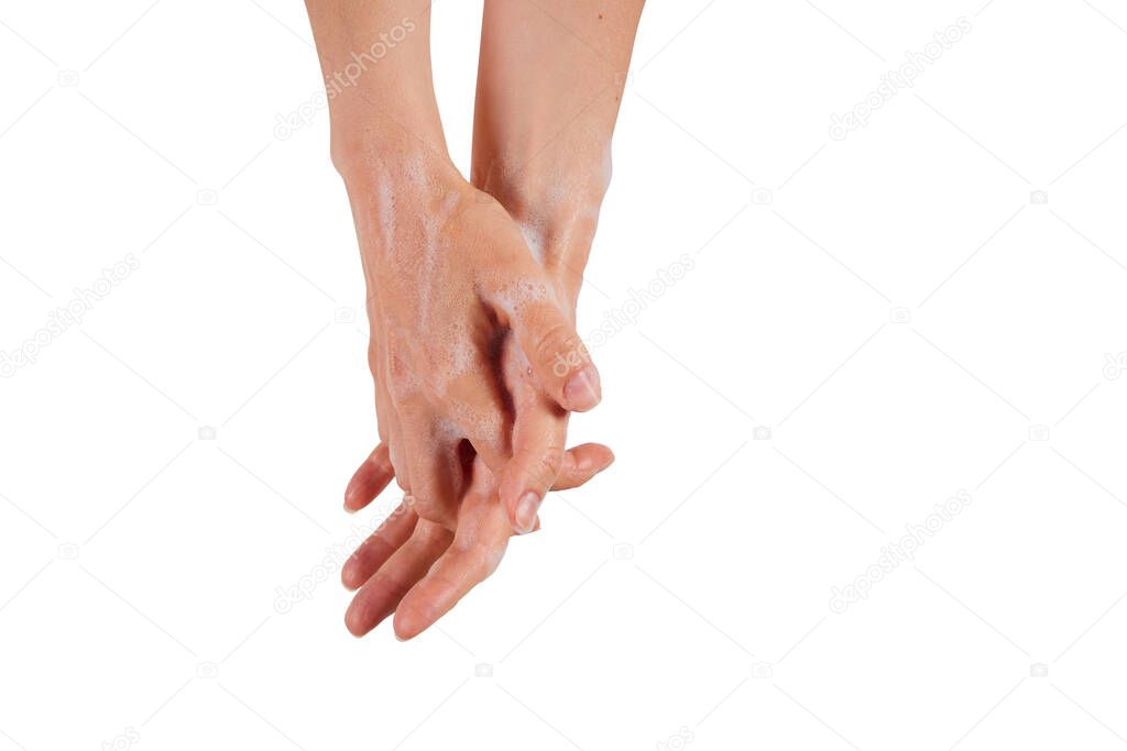 A woman clasping and rubbing hands while spreading antibacterial soap against white background
