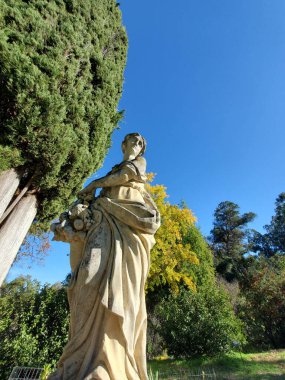 A low-angle shot of Pomona goddess statue in the garden