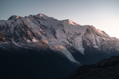 A beautiful view of the snowy Alps mountain during sunset in France