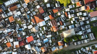 An aerial drone shot of a cemetery with thousands of tombs