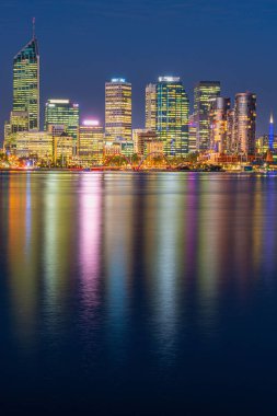 A vertical shot of the night skyline of Perth, Australia