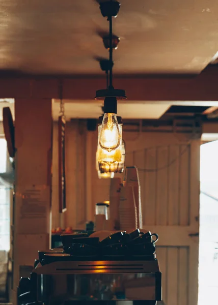 Vertical Shot Lights Hanging Coffee Machines Cups Cafe — Stock Photo, Image