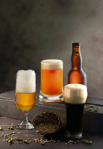 Vertical Shot Different Glasses Foamy Beer Bottle Beer — Stock Photo, Image