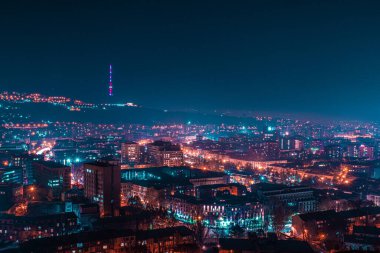 A breathtaking aerial view of the illuminated Yerevan cityscape at night