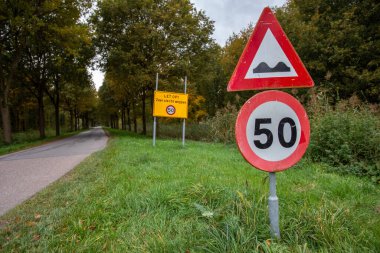 The warning signs on the side of the road in the Netherlands