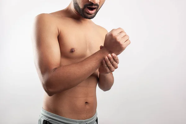 Shirtless Young Asian Guy Clutching His Wrist Injury Pain White — Stockfoto