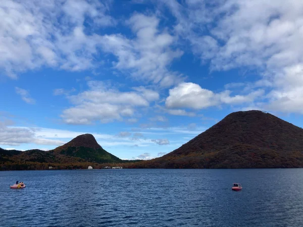 Beautiful Calm Lake Boats Surrounded Evergreen Hills — Stock Fotó