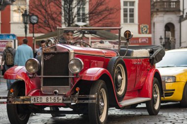 historic taxi parked in the street. Red Praga