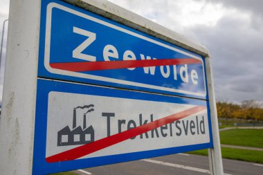 The signs with red lines indicating the end of Zeewolde and Trekkersveld in the Netherlands