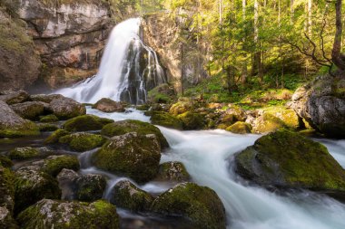 A beautiful shot of a waterfall in a mountain