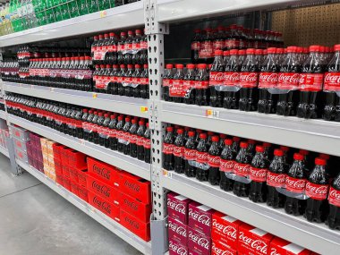 Augusta, Ga USA - 04 21 22: Walmart Retail store drinks front facing 6 packs Coca Cola distant side view