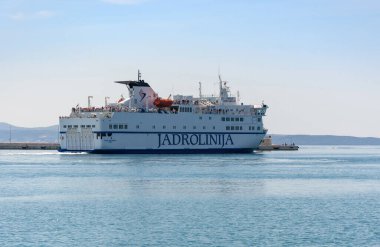 A large ferry ship leaving port of Split in Croatia