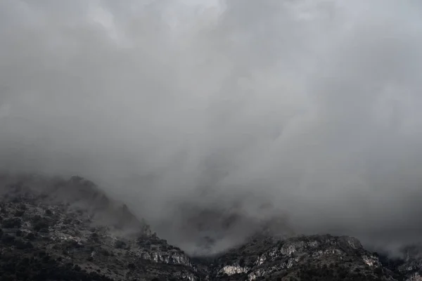 The mountain range covered with gray clouds. Monte Carlo, Monaco.