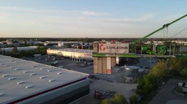 An aerial view around a crane in Warsaw's suburbs in HD