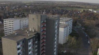 A high angle drone footage of old stone buildings of a town on a sunny day