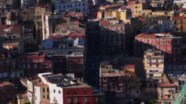 A bird's eye view of cars moving in a street in Naples, Italy
