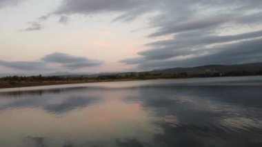 A top view of the Lake Laguna with the sunset clouds reflected in the water
