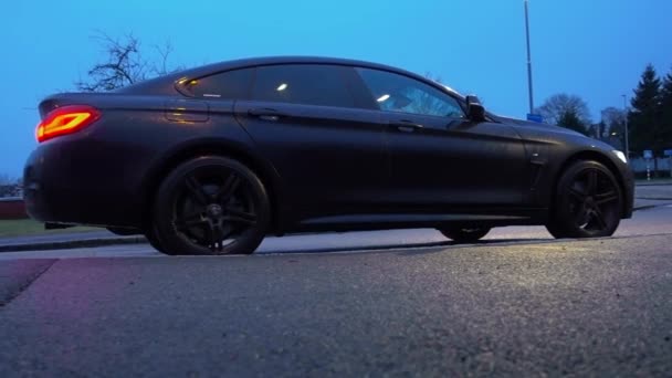 Black Car Parked Asphalt Road Rainy Day Twilight Gothenburg Sweden — Wideo stockowe