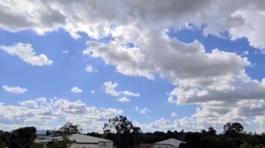 A time-lapse footage of white clouds floating in the blue sky