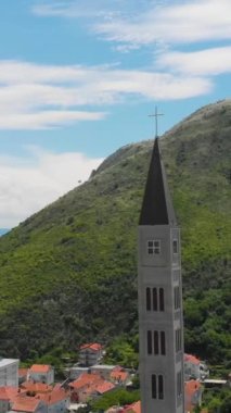 A vertical aerial footage of the Church of Saints Peter and Paul in Mostar, Bosnia and Herzegovina
