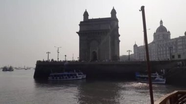 The Mumbai coast with Gateway of India and historic buildings as seen from ferry. Mumbai coast with a gateway of India and historic building as seen
