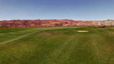 A drone shot of the Ledges of St. George Golf Course in Utah under a blue sky