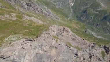A beautiful view of the alps mountains under the blue sky