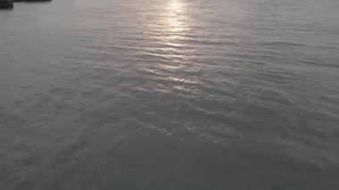A high angle view of a white boat sailing on Madeira Island, Portugal