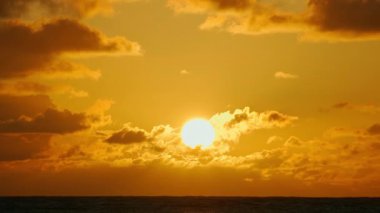Sunrise over the water at Lanikai Beach in Honolulu, Hawaii. Shot with telephoto lens.