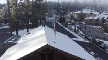 An aerial view of houses covered in snow