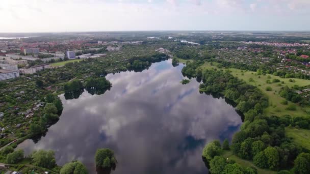Drone Flying Lake Buildings Trees Meadow Park Uhd — Video