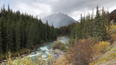 National park Jasper in Alberta, Canada, in the autumn, mountains, river, clouds, colors