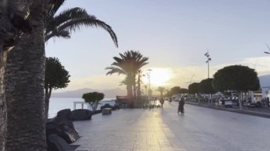 A promenade in Puerto del Carmen, Spain, the Canary Islands, during the sunset