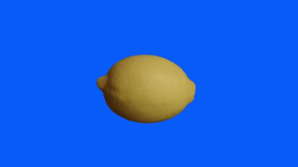 Slow Motion Lemon Isolated Blue Background — Stockvideo