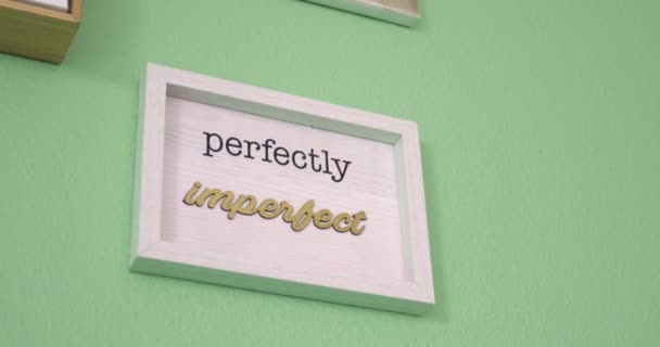 View Sign Saying Perfectly Imperfect White Frame Hanging Green Wall — Stock videók