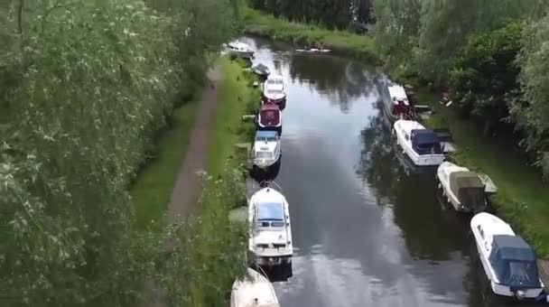 Aerial View Boats Parked Narrow River Surrounded Fields Trees — Stockvideo