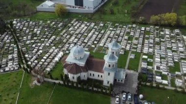 a circular aerial video around a church in Reghin city - Romania