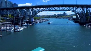An aerial view of Burrard Bridge above Granville Island in Vancouver, Canada