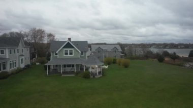 An aerial view modern houses in the beautiful forest on a sunny day
