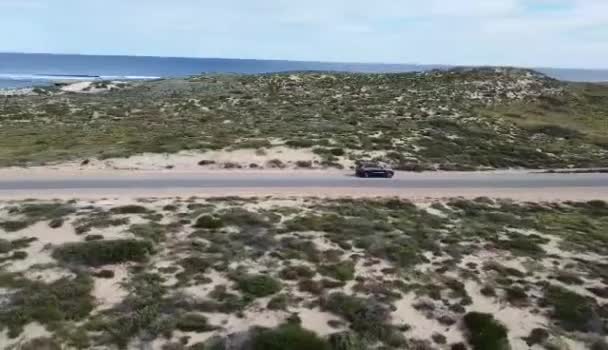 Drone Footage Black Car Driving Country Road Background Sea — Vídeos de Stock