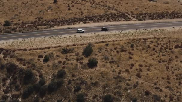 Aerial Footage Two Cars Traveling Deserted Highway — Stockvideo