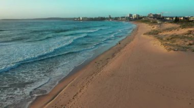A beautiful view of ocean waves reaching the beach